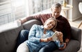 Sunday afternoons done right. a mature couple reading a book together while relaxing on the sofa at home. Royalty Free Stock Photo