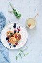 Sunday breakfast with cheesecake, honey, fresh berries and mint. Cottage cheese pancakes