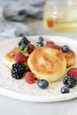 Sunday breakfast with cheesecake, honey, fresh berries and mint. Cottage cheese pancakes