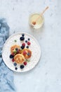 Sunday breakfast with cheesecake, honey, fresh berries and mint. Cottage cheese pancakes Royalty Free Stock Photo