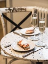 Sunday brunch with prosecco and eggs and salmon bruschetta on marble table Royalty Free Stock Photo