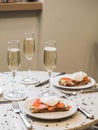 Sunday brunch with prosecco and eggs and salmon bruschetta on marble table Royalty Free Stock Photo