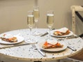 Sunday brunch with prosecco and eggs and salmon bruschetta on marble table Royalty Free Stock Photo