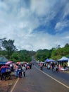 Sunday market which is next to the main road but rarely passed by many vehicles in the middle there is a bridge