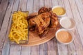 Sunday menu with roast chicken with the skin well fried and crispy, sauces for dipping and a large portion