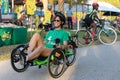 Woman smiling on her recumbent bike, editorial.