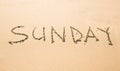 Sunday written on a tropical beach Royalty Free Stock Photo