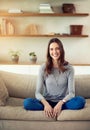 Sundays sure feel good. Portrait of an attractive young woman relaxing on the sofa at home.