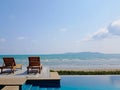 Sundeck or bench on Sea view with private swimming pool for vacation at summer time and beautiful clear sky in the background, Royalty Free Stock Photo