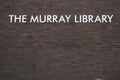 Exterior shot of The Murray Library, part of the University of Sunderland, signage on brick wall