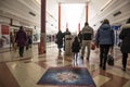 People shoppers inside a modern shopping mall centre mall walking