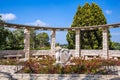 Sundial and blooming rose garden