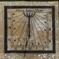 Sundial on the church of St Andrew in the Cotswold village of Chedworth, Gloucestershire, UK