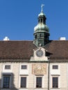 Sundial and clock in facade of Amalienburg, part of Hofburg Imperial Palace in Vienna