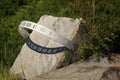 Sundial indicating noon, stone, metal, sun and shade Royalty Free Stock Photo