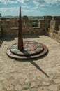 Sundial made of iron over stone tower at Avila