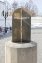 Sundial from metal in the form of a Christian cross.