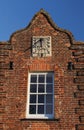 Sundial in an old building Facade Royalty Free Stock Photo
