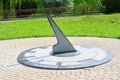 Sundial showing noon in the park. Determination of time Royalty Free Stock Photo