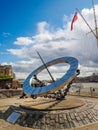 The sundial at St. Katharine docks next to Tower Bridge over the River Thames in London, UK on a sunny day. Royalty Free Stock Photo
