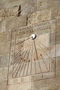 Sundial on a wall in Castle of Montjuic in Barcelona, Spain Royalty Free Stock Photo