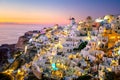 Sundown evening view of traditional Greek village Oia on Santorini island in Greece. Santorini is iconic travel destination in Royalty Free Stock Photo