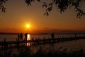 Sundown in the lake with people Royalty Free Stock Photo