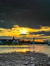 Sundown over the riverside of the river Rhein in Cologne at the Sandy beach shore Royalty Free Stock Photo