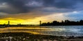 Sundown over the riverside of the river Rhein in Cologne at the Sandy beach shore Royalty Free Stock Photo