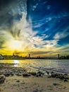 Sundown over the riverside of the river Rhein in Cologne at the Sandy beach shore Royalty Free Stock Photo