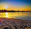 Sundown over the sandy Beach of the river Rhein in Cologne, Germany with cloudy sky and sand