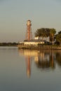 Sundown and reflection of a lighthouse at Sumter Landing, Florida, USA