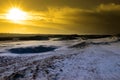 Sundown on a snow covered links golf course Royalty Free Stock Photo