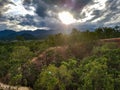 Sundown sunset warm light shines open clouds sky trees cliffs rocks sandstone canyon pai mountains north chiang mai asia