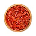 Sun dried tomatoes, Julienne strips in a wooden bowl, from above Royalty Free Stock Photo