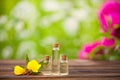 Sundrops essential oil in beautiful bottle on wooden background