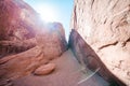 Sunflare through the red rocks along the Devils Garden trail in Arches National Park Utah Royalty Free Stock Photo