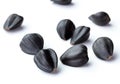 Sunflower black seeds in group isolated white background