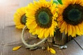 Sunflower bouquet in the wooden box on the wood table. Nice greeting card design Royalty Free Stock Photo