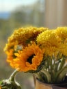 Sunflower and chrysanthemum bouquet in golden autumn sunset