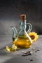 Sunflower oil on dark concrete background with shadows . Vertical format Royalty Free Stock Photo