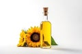 Sunflower oil. Glass bottle of yellow oil with wooden cork. Sunflower flowers nearby. Isolated on white background. With Royalty Free Stock Photo