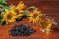Sunflower oil in a glass gravy boat, and a handful of sunflower seeds Royalty Free Stock Photo