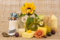 Sunflower oil and soap on a brown hemp sack background.