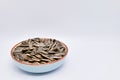 sunflower seeds in a bowl on white background Royalty Free Stock Photo