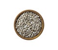 Sunflower seeds isolated on white background. Top view. Sunflower seeds in a wooden bowl isolated on white background.