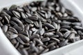 Sunflower seeds lying in a plate can serve as a background_ Royalty Free Stock Photo