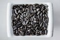 Sunflower seeds lying in a plate can serve as a background_ Royalty Free Stock Photo