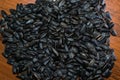 Sunflower seeds lying on the wood table. Blurred background. Royalty Free Stock Photo