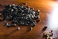 Sunflower seeds lying on the wood table. Blurred background. Royalty Free Stock Photo